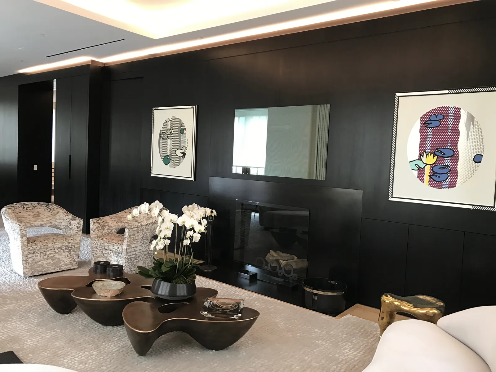 Refined residential living room with full-height custom built-ins and warm wood casework by Cano's Wood Interiors