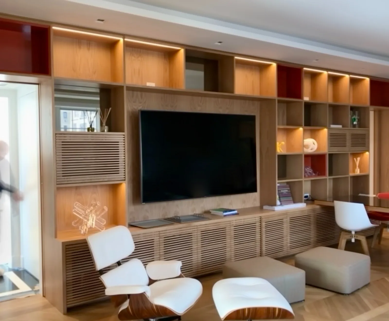 Cano's Wood Interiors crew installing custom built-in millwork on site